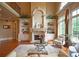 Living room featuring a fireplace, built-in shelves, and a staircase at 3299 Carmichael Pl, Duluth, GA 30097