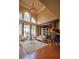 Bright living room with soaring ceilings, arched windows, hardwood floors, and grand chandelier at 3299 Carmichael Pl, Duluth, GA 30097