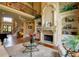 Elegant living room with a fireplace, built-in shelves, and a staircase at 3299 Carmichael Pl, Duluth, GA 30097