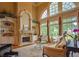 Bright living room featuring a fireplace, built-in shelves, and a large window at 3299 Carmichael Pl, Duluth, GA 30097