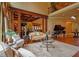 Spacious living room with wood trim, coffered ceilings, and a grand piano at 3299 Carmichael Pl, Duluth, GA 30097
