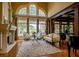Sophisticated living room featuring a fireplace and large windows at 3299 Carmichael Pl, Duluth, GA 30097