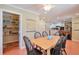 Dining room featuring a table that seats six, tile flooring, and an adjacent pantry with shelving at 3868 Sharon Dr, Powder Springs, GA 30127