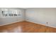 Bedroom with hardwood floors, neutral paint, and large window with plantation shutters at 1445 Monroe Ne Dr # 14F, Atlanta, GA 30324