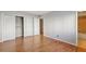Spacious bedroom featuring wood flooring, neutral paint, and double closets for ample storage at 1445 Monroe Ne Dr # 14F, Atlanta, GA 30324