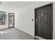 Welcoming entryway featuring a modern front door with stylish hardware and a well-lit porch at 1445 Monroe Ne Dr # 14F, Atlanta, GA 30324
