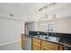Bright kitchen with granite countertops, stainless steel dishwasher, and modern pendant lighting at 1445 Monroe Ne Dr # 14F, Atlanta, GA 30324
