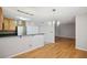 Open floor plan with stainless steel appliances, hardwood floors, and granite breakfast bar seating at 1445 Monroe Ne Dr # 14F, Atlanta, GA 30324