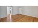 Living room featuring hardwood floors, neutral walls, and plenty of natural light at 1445 Monroe Ne Dr # 14F, Atlanta, GA 30324