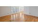 Spacious living room featuring gleaming hardwood floors and lots of natural light at 1445 Monroe Ne Dr # 14F, Atlanta, GA 30324