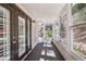 Bright sunroom with multiple windows offering serene outdoor views and natural light at 1445 Monroe Ne Dr # 14F, Atlanta, GA 30324