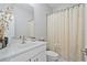 Bathroom featuring a white vanity, a sink, and a tile shower at 2638 Songbird Ln, Grayson, GA 30017
