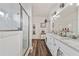 Bathroom featuring double vanity with granite counters and a glass door shower at 2638 Songbird Ln, Grayson, GA 30017