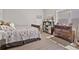 Bright bedroom featuring wood floors, natural light, and a charming bookcase for stylish storage at 2638 Songbird Ln, Grayson, GA 30017