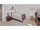 Bedroom featuring a window and light colored walls at 2638 Songbird Ln, Grayson, GA 30017