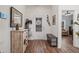 Bright entryway with hardwood floors, stylish decor, and a view into the living spaces at 2638 Songbird Ln, Grayson, GA 30017