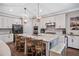 Kitchen features stainless appliances, granite countertops and island with seating at 2638 Songbird Ln, Grayson, GA 30017