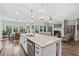 Bright, open kitchen featuring an island with granite countertops and stainless steel appliances at 2638 Songbird Ln, Grayson, GA 30017