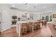 This kitchen features stainless appliances, granite countertops and an island with bar stool seating at 2638 Songbird Ln, Grayson, GA 30017