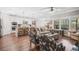 Open-concept living area with a kitchen island, living room seating, and ample natural light at 2638 Songbird Ln, Grayson, GA 30017