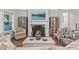 Cozy living room featuring a fireplace, comfortable seating, and elegant decor at 2638 Songbird Ln, Grayson, GA 30017