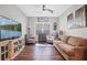 Bright and airy living room with a large TV, comfortable seating, and stylish decor at 2638 Songbird Ln, Grayson, GA 30017