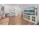 Inviting living room featuring a large TV, ample seating, and easy access to the staircase at 2638 Songbird Ln, Grayson, GA 30017