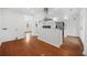 Bright kitchen with stainless steel appliances, white cabinetry, and wooden floors at 733 Pegg Sw Rd, Atlanta, GA 30315