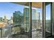 A balcony with iron chairs overlooking the vibrant Atlanta skyline, offering a relaxing outdoor space at 855 Peachtree Ne St # 1906, Atlanta, GA 30308