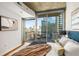 Bright bedroom with a balcony and views of the city at 855 Peachtree Ne St # 1906, Atlanta, GA 30308