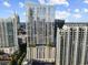 Modern high-rise building showcasing upscale architectural design and a pool deck amenity at 855 Peachtree Ne St # 1906, Atlanta, GA 30308