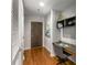 Entry hallway featuring a built-in desk, wood floors, and modern decor at 855 Peachtree Ne St # 1906, Atlanta, GA 30308