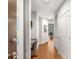 Hallway leading to a bright living space with hardwood floors and built-in desk at 855 Peachtree Ne St # 1906, Atlanta, GA 30308