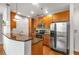 Kitchen with stainless steel appliances, granite countertops and wood cabinetry at 855 Peachtree Ne St # 1906, Atlanta, GA 30308