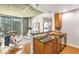 Modern kitchen with granite countertops, stainless steel appliances and an adjacent dining area at 855 Peachtree Ne St # 1906, Atlanta, GA 30308