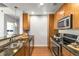 Well-appointed kitchen featuring granite countertops, stainless steel appliances and ample storage at 855 Peachtree Ne St # 1906, Atlanta, GA 30308