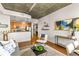 Open concept living space with concrete ceilings, hardwood floors, and modern finishes at 855 Peachtree Ne St # 1906, Atlanta, GA 30308