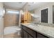 Neutral toned bathroom with tub-shower combo and granite countertops at 2011 Braeburn Se Cir, Atlanta, GA 30316