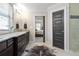 Bright bathroom features granite countertops, double sinks, tiled floor and a view into the bedroom at 2011 Braeburn Se Cir, Atlanta, GA 30316