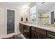 Neutral bathroom features granite countertops, double sinks, and a view out the window at 2011 Braeburn Se Cir, Atlanta, GA 30316