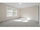 Sunlit bedroom with neutral carpet, large windows, and ample natural light at 2011 Braeburn Se Cir, Atlanta, GA 30316