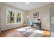 Cozy room showcasing a window view, hardwood flooring, and a decorative rug at 2011 Braeburn Se Cir, Atlanta, GA 30316