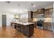 Modern kitchen featuring a large island, stainless steel appliances, and ample storage at 2011 Braeburn Se Cir, Atlanta, GA 30316
