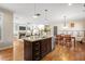 Open kitchen with granite countertops, stainless steel appliances, and hardwood floors at 2011 Braeburn Se Cir, Atlanta, GA 30316