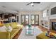 Bright living room showcasing hardwood floors, modern furniture, and access to the backyard at 2011 Braeburn Se Cir, Atlanta, GA 30316