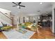 Spacious living room with an open layout, hardwood floors, and modern lighting at 2011 Braeburn Se Cir, Atlanta, GA 30316