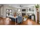Open-concept living room features hardwood floors, built-in shelving and cozy fireplace at 2011 Braeburn Se Cir, Atlanta, GA 30316