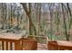 Wooden stairs lead to a private wooded backyard space with mature trees at 2242 Greencrest Ne Dr, Atlanta, GA 30345