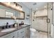 Updated bathroom with double vanity, sleek fixtures, and a walk-in shower with tile surround at 2242 Greencrest Ne Dr, Atlanta, GA 30345