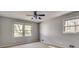 Bright bedroom featuring two windows for natural light and neutral walls at 2242 Greencrest Ne Dr, Atlanta, GA 30345